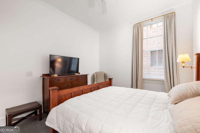 bedroom featuring carpet, ceiling fan, and ornamental molding