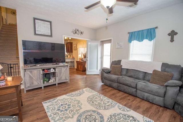 living room featuring hardwood / wood-style flooring and ceiling fan