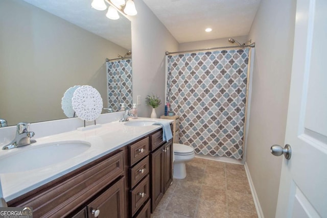 bathroom with a shower with curtain, vanity, and toilet