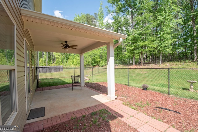 view of patio / terrace featuring ceiling fan and fence