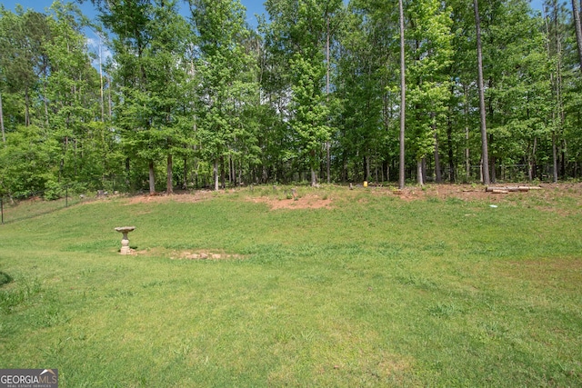 view of yard featuring a view of trees