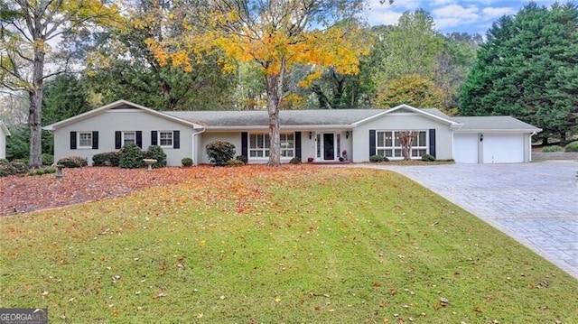 ranch-style home with a front yard and a garage