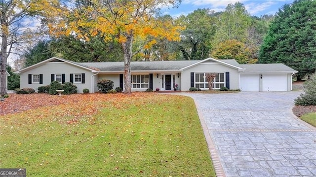 ranch-style house with a front yard and a garage