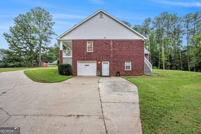 view of property exterior with a yard and a garage