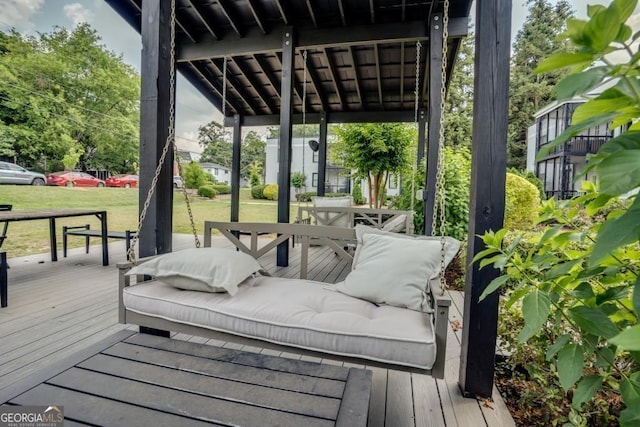 deck featuring an outdoor living space and a yard