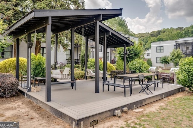 view of community with a wooden deck