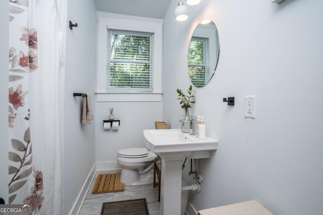 bathroom with tile patterned floors and toilet