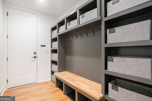 mudroom with wood-type flooring