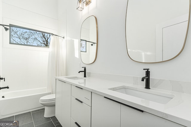 full bathroom with toilet, shower / bath combo with shower curtain, tile patterned floors, and vanity