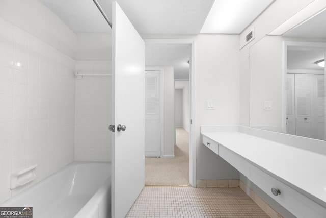 bathroom featuring tile patterned flooring and vanity