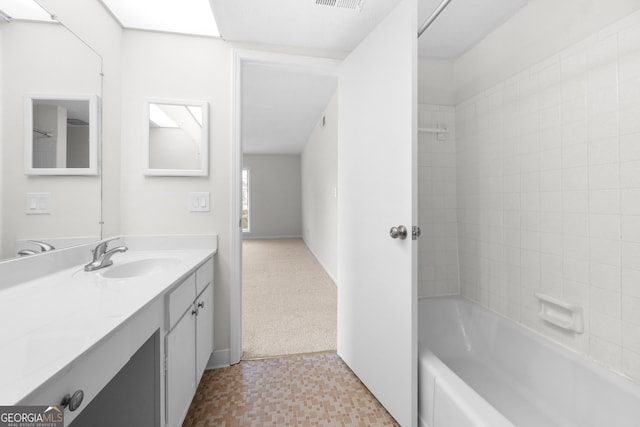 bathroom with vanity and shower / bathtub combination