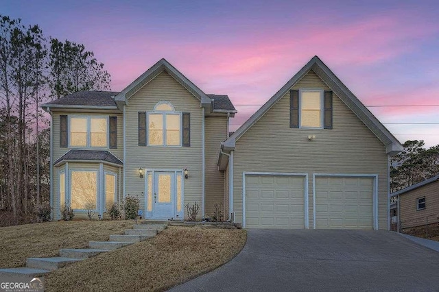 front of property with a garage