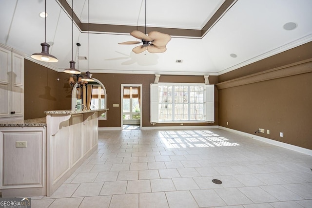 unfurnished living room featuring ceiling fan, light tile patterned flooring, and ornamental molding