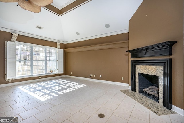 unfurnished living room featuring a fireplace, light tile patterned floors, crown molding, and lofted ceiling