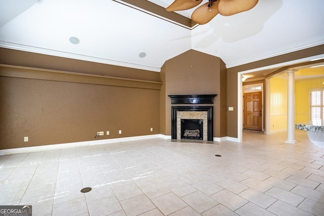 unfurnished living room featuring decorative columns, ceiling fan, lofted ceiling, and light tile patterned flooring