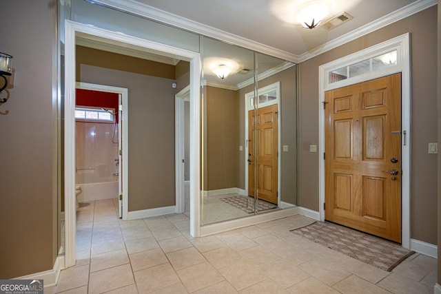 tiled entryway with ornamental molding