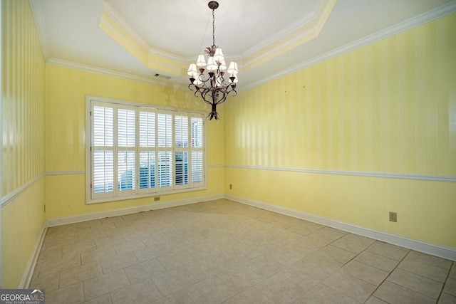 empty room featuring an inviting chandelier, light tile patterned flooring, ornamental molding, and a tray ceiling