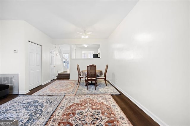 dining room featuring ceiling fan and dark hardwood / wood-style flooring