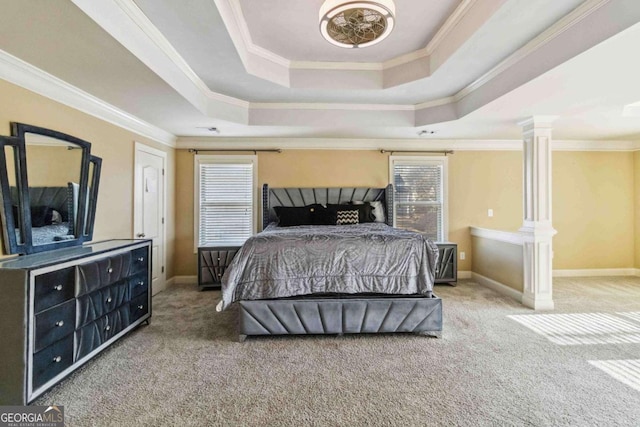 carpeted bedroom featuring a raised ceiling and ornamental molding