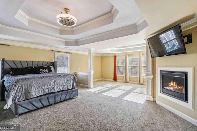 bedroom featuring crown molding, ceiling fan, a tray ceiling, light colored carpet, and multiple windows