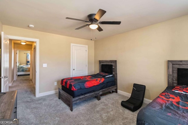 carpeted bedroom with ceiling fan