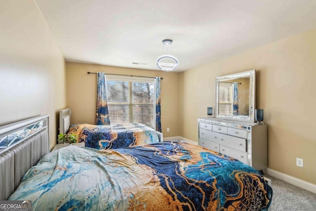 bedroom with light colored carpet