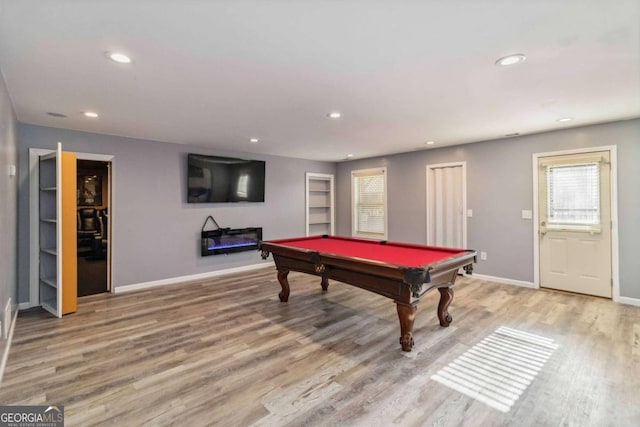 game room with hardwood / wood-style flooring and billiards