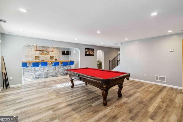 playroom featuring billiards, indoor bar, and light wood-type flooring