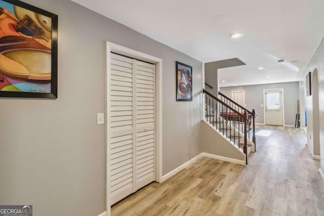 hallway with light hardwood / wood-style flooring