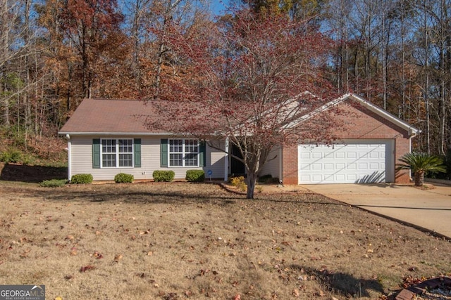 single story home with a garage and a front lawn