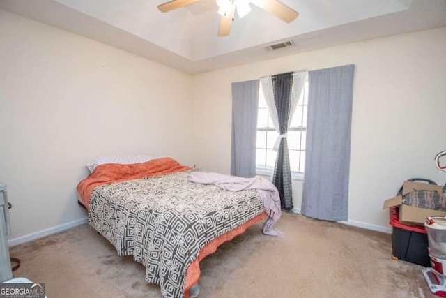 bedroom with light carpet and ceiling fan