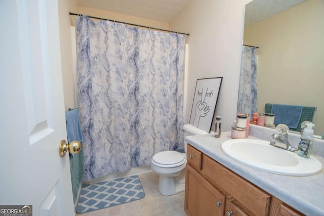 bathroom featuring walk in shower, tile patterned flooring, vanity, and toilet