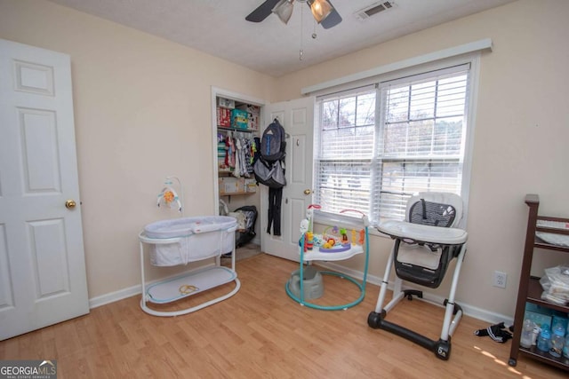 misc room featuring light hardwood / wood-style flooring and ceiling fan