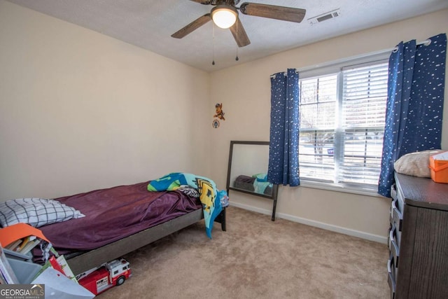 bedroom featuring light carpet and ceiling fan