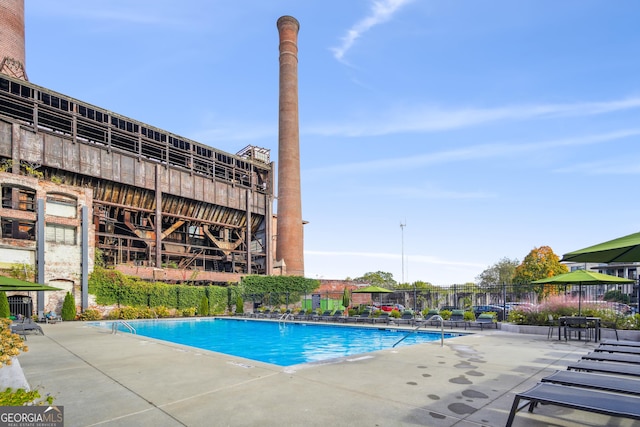 view of swimming pool with a patio area