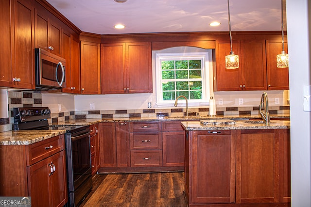 kitchen featuring black range oven, sink, dark hardwood / wood-style floors, light stone countertops, and decorative light fixtures