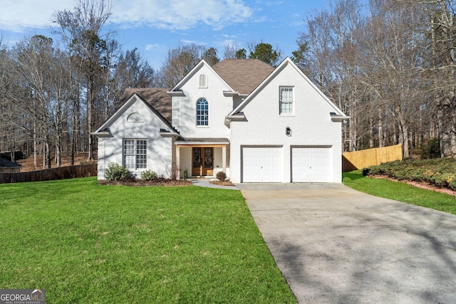 view of front property with a front lawn and a garage