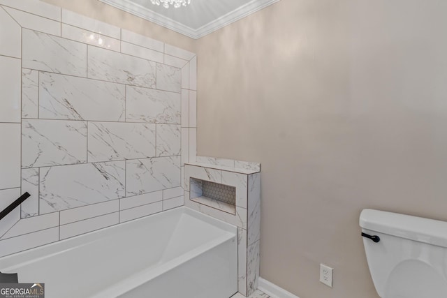 bathroom featuring a washtub, toilet, and crown molding