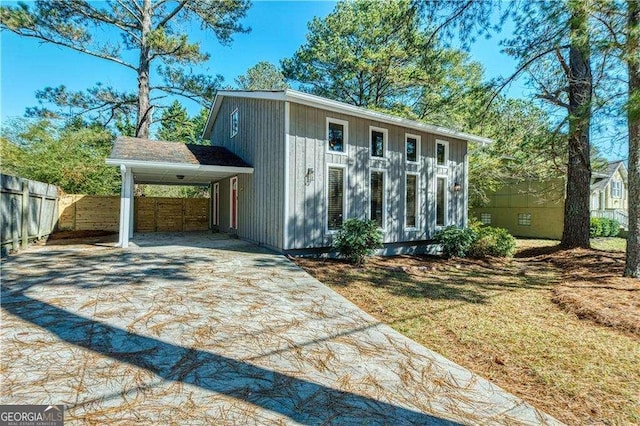 view of outdoor structure with a yard and a carport