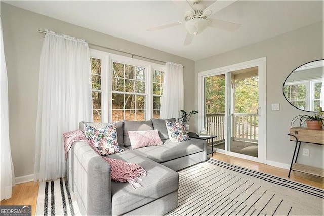 sunroom featuring ceiling fan