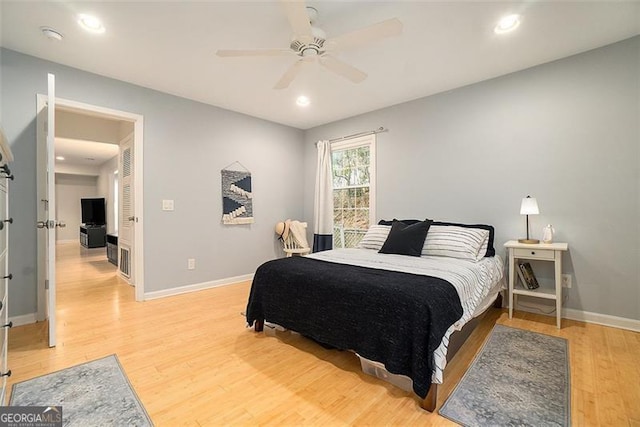 bedroom featuring ceiling fan and hardwood / wood-style floors