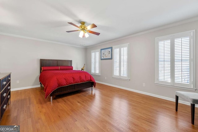 bedroom featuring light wood-type flooring, ceiling fan, and ornamental molding