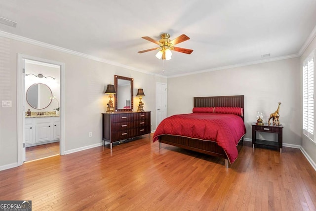 bedroom featuring ceiling fan, crown molding, connected bathroom, and multiple windows