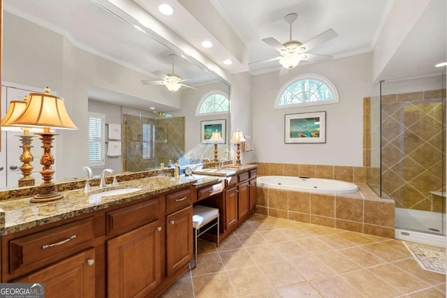 bathroom with tile patterned floors, vanity, ceiling fan, crown molding, and separate shower and tub