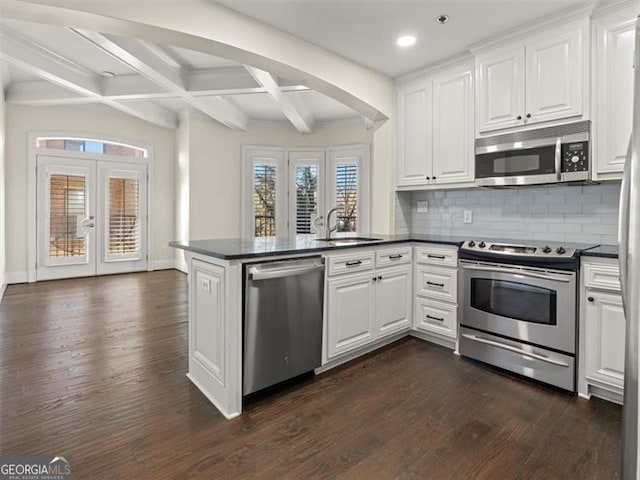 kitchen featuring white cabinetry, french doors, kitchen peninsula, and appliances with stainless steel finishes