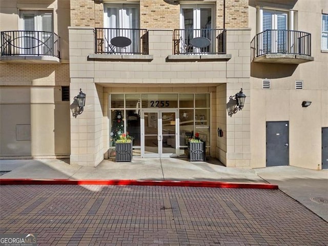 property entrance featuring french doors