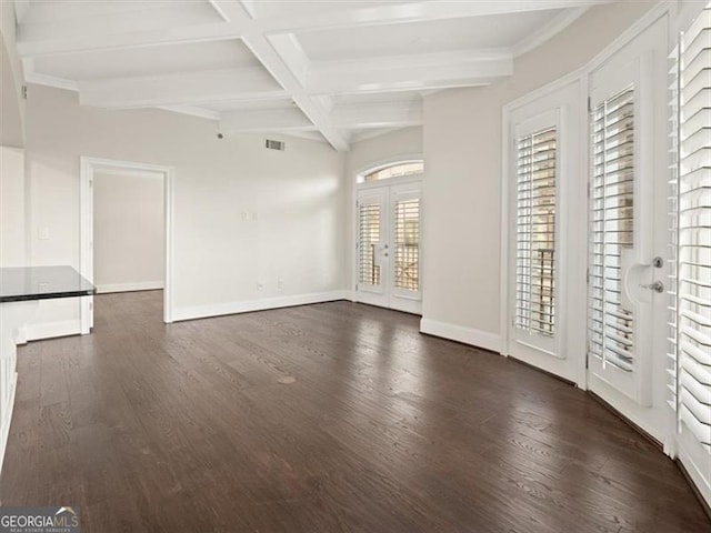 unfurnished living room featuring dark hardwood / wood-style flooring, coffered ceiling, french doors, and beamed ceiling