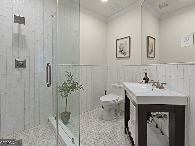 bathroom featuring tile walls, ornamental molding, an enclosed shower, toilet, and tile patterned floors