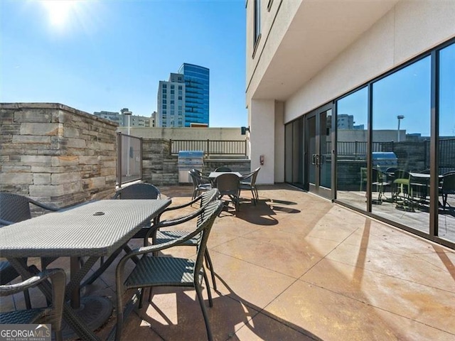 balcony with area for grilling and a patio area