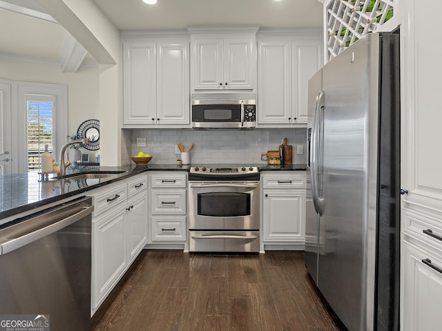 kitchen featuring appliances with stainless steel finishes, sink, and white cabinets